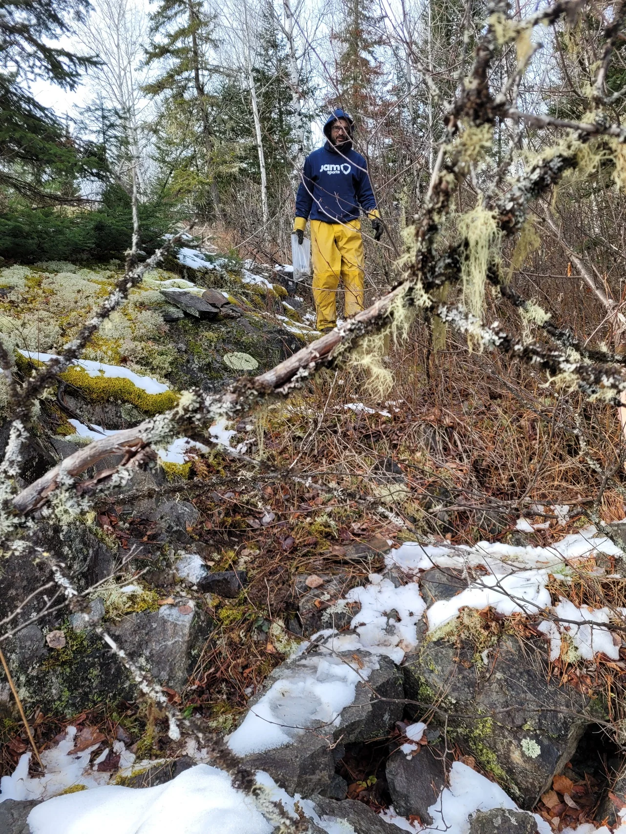 Brian Edgar at the western Main Zone showing amid snow-covered outcrops.